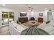 Comfortable living room featuring a fireplace, entertainment center, and sliding doors to the outdoor area at 5334 E Everett Dr, Scottsdale, AZ 85254