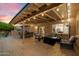 Covered patio featuring stylish seating and an outdoor fireplace for entertaining at 5334 E Everett Dr, Scottsdale, AZ 85254