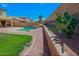 A private backyard with a pool and lush greenery with cactus and other foliage at 5425 W Harwell Rd, Laveen, AZ 85339