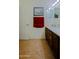 Bright bathroom featuring wood cabinets, modern fixtures, and a decorative painting at 5425 W Harwell Rd, Laveen, AZ 85339