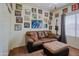 Stylish bedroom with comfy couch, ottoman, and decoratively framed artwork at 5425 W Harwell Rd, Laveen, AZ 85339