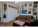 Spacious bedroom features couch, ottoman, and decoratively framed artwork at 5425 W Harwell Rd, Laveen, AZ 85339