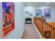 Well-lit hallway with artwork, showcasing the home's stylish interior and design at 5425 W Harwell Rd, Laveen, AZ 85339