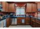 Functional kitchen showcasing stainless steel appliances and granite countertops at 5425 W Harwell Rd, Laveen, AZ 85339