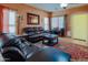 Inviting living room featuring a plush leather sofa and stylish rug at 5425 W Harwell Rd, Laveen, AZ 85339