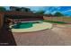 Aerial view of a backyard pool with a stone border and expansive yard with secured perimeter fencing at 5425 W Harwell Rd, Laveen, AZ 85339