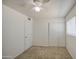 This carpeted bedroom has a window with blinds, a standard closet, and sliding closet doors at 646 W Grove Cir, Mesa, AZ 85210