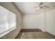 Bedroom featuring neutral carpet, white trim, and a window with horizontal blinds at 646 W Grove Cir, Mesa, AZ 85210