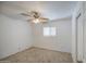 Bright bedroom features neutral carpet, ceiling fan and a window with blinds at 646 W Grove Cir, Mesa, AZ 85210