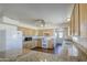 A light and bright kitchen featuring granite countertops, wood cabinets, and stainless steel appliances at 646 W Grove Cir, Mesa, AZ 85210