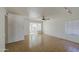 Open living room featuring tile flooring, neutral walls, and a ceiling fan at 646 W Grove Cir, Mesa, AZ 85210