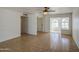 Bright living room with tile floors, white walls, and a ceiling fan at 646 W Grove Cir, Mesa, AZ 85210