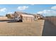 View of the backyard and house featuring desert landscaping, and a parked truck at 6836 W Bronco Trl, Peoria, AZ 85383