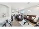 Inviting living room with tile floors, leather seating, and natural light at 6836 W Bronco Trl, Peoria, AZ 85383