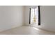 Well-lit bedroom with a large window providing ample natural light at 7006 E Jensen St # 40, Mesa, AZ 85207