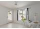 Bright bedroom with a white desk, ceiling fan, and a view of the backyard at 7006 E Jensen St # 40, Mesa, AZ 85207