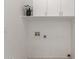 Clean laundry room with white cabinets and new laundry hook-ups ready for appliances at 7006 E Jensen St # 40, Mesa, AZ 85207