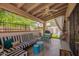 Covered patio with a ceiling fan, outdoor seating, and access to the backyard at 7315 E Arlington Rd, Scottsdale, AZ 85250