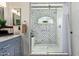 Bathroom featuring a shower with marble countertops and glass doors at 7315 E Arlington Rd, Scottsdale, AZ 85250