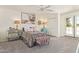 Bedroom featuring french doors, soft gray carpet, and neutral color palette at 7315 E Arlington Rd, Scottsdale, AZ 85250