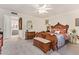 Bedroom features elegant wood furniture, soft carpet, and an ensuite bath at 7315 E Arlington Rd, Scottsdale, AZ 85250