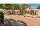 Landscaped community entrance with gated access, fountain, and colorful flowers at 7315 E Arlington Rd, Scottsdale, AZ 85250