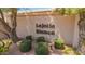 Community entrance sign 'La Jolla Blanca' surrounded by trees and manicured landscaping at 7315 E Arlington Rd, Scottsdale, AZ 85250