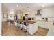 Open concept kitchen with stainless steel appliances, breakfast bar and wood-look tile flooring at 7315 E Arlington Rd, Scottsdale, AZ 85250