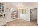 Eat-in kitchen featuring wood-look tile, modern lighting, granite countertops, and stainless appliances at 7315 E Arlington Rd, Scottsdale, AZ 85250