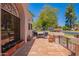 Outdoor patio area features terracotta tiles, wrought iron railings, and comfortable seating for relaxation and entertainment at 7315 E Arlington Rd, Scottsdale, AZ 85250