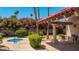 Community pool area featuring a hot tub, outdoor seating, and mature landscaping at 7315 E Arlington Rd, Scottsdale, AZ 85250