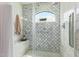 Tiled shower featuring marble countertops and glass doors at 7315 E Arlington Rd, Scottsdale, AZ 85250