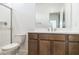 Bathroom featuring a toilet, single vanity, and walk-in shower at 7444 W Buckhorn Trl, Peoria, AZ 85383
