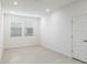 Bright bedroom with neutral walls, white trim, and ample natural light from two windows at 7444 W Buckhorn Trl, Peoria, AZ 85383