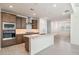 Stylish kitchen with stainless steel appliances, island with sink, and contemporary finishes at 7444 W Buckhorn Trl, Peoria, AZ 85383