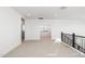 Bright loft area with neutral carpet and fresh white walls, offering versatile living space at 7444 W Buckhorn Trl, Peoria, AZ 85383