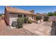 Lovely backyard with brick-paved patio, complemented by rock landscaping and manicured greenery around the home at 7709 W Tonto Dr, Glendale, AZ 85308