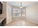 Cozy dining area with a bay window overlooking the back yard, complete with decorative lighting at 7709 W Tonto Dr, Glendale, AZ 85308