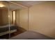 View of bedroom with mirrored closet doors at 7807 E Main St # F-35, Mesa, AZ 85207