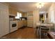Functional kitchen and dining area features ample cabinet space and natural light at 7807 E Main St # F-35, Mesa, AZ 85207