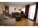 Inviting living room with comfortable sofas, wood flooring, and a sliding glass door at 7807 E Main St # F-35, Mesa, AZ 85207