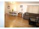 Open-concept living and dining area with wood floors and bright lighting at 7807 E Main St # F-35, Mesa, AZ 85207