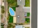 Aerial view of a private backyard featuring a beautiful in-ground swimming pool, privacy landscaping, and outdoor seating at 8419 E Rancho Vista Dr, Scottsdale, AZ 85251