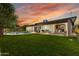 Expansive backyard with pool, lush lawn, and covered patio, perfect for outdoor enjoyment at 8419 E Rancho Vista Dr, Scottsdale, AZ 85251