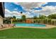Inviting backyard pool with a well-manicured lawn, offering a refreshing oasis for relaxation and entertainment at 8419 E Rancho Vista Dr, Scottsdale, AZ 85251