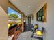 Welcoming front porch with seating, great curb appeal, and a view of the landscaped yard at 8419 E Rancho Vista Dr, Scottsdale, AZ 85251