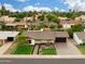 Charming home with manicured lawn, tasteful landscaping and a welcoming front porch at 8419 E Rancho Vista Dr, Scottsdale, AZ 85251
