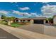 Beautiful single-story home with a wide driveway, well-maintained lawn, and inviting front porch at 8419 E Rancho Vista Dr, Scottsdale, AZ 85251