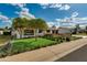 Well-kept single-story home with manicured lawn, lush landscaping, and charming front porch at 8419 E Rancho Vista Dr, Scottsdale, AZ 85251