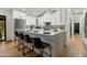 Modern kitchen with island, white cabinets, stainless steel appliances, and bar seating at 8419 E Rancho Vista Dr, Scottsdale, AZ 85251